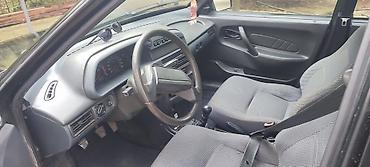 VAZ (LADA): Lada Samara – qara rəngli hetçbek Xüsusiyyətlər: - Kuzov: 5 qapılı — 7