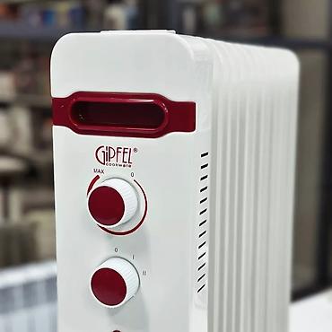 Масляные обогреватели: Масляный обогреватель Кол-во секций: 7, Быстрый нагрев, Встроенный вентилятор, Несколько режимов мощности — 8