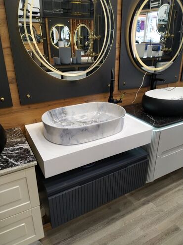 Haima: Oval formalı, mərmər naxışlı ağ rəngli qab lavabo. Ağ səthli