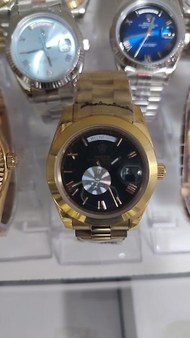 rolex daydate: Məhsul: Kvars mexanizmli klassik kişilər üçün qol saatları (Rolex — 10
