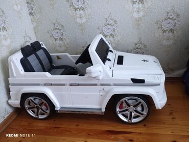 uşaq arabaları transformer: Uşaq üçün elektrikli minik maşını – ağ rəngli SUV/G-class üslubunda -