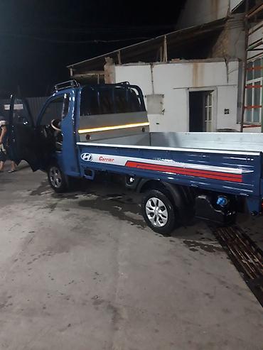 Коммерческий транспорт: Hyundai Porter II, бортовой грузовик в синем цвете. Компактный — 6