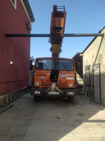 бампер опель вектра б: KAMAZ markalı, narıncı rəngdə avtokran. Tikinti və quraşdırma işləri