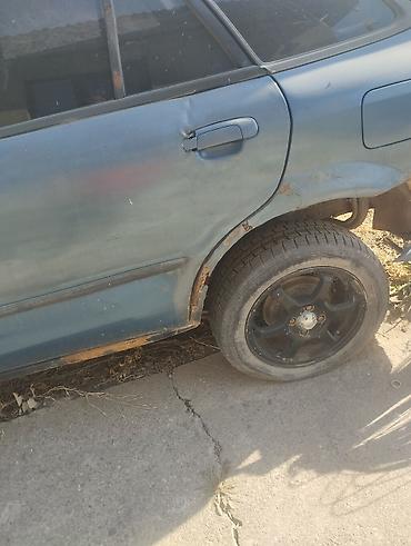 е 34 тарпеда сидения: Mazda 323: 2001 г., 1.6 л, Механика, Бензин, Универсал — 7