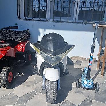 das utu: Uşaq üçün elektrikli kvadrosikl. Qırmızı rəngli, 4 təkərli uşaq — 4