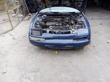 Скупка авто: Mazda 323F, хэтчбек 5 дв., темно‑синий цвет, на разбор. - Кузов: 323F — 8