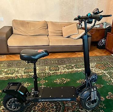 Электротранспорт: Elektrik skuter – oturacaqlı, güclü asqılı və geniş platformalı, 60 km — 2