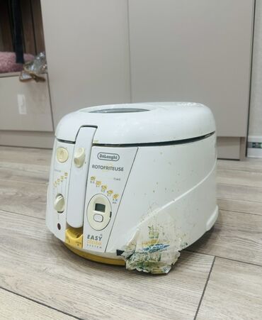 уч кайнар: Фритюрница De'Longhi Rotofryer в белом корпусе с желтыми акцентами