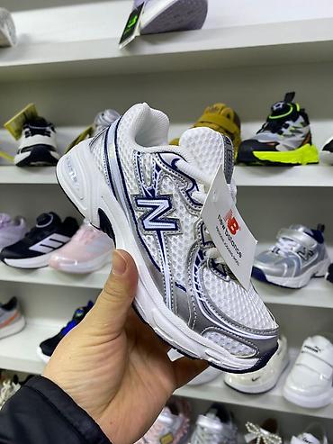 Детская обувь: Кроссовки и кеды — широкий выбор моделей на полках магазина. - — 10