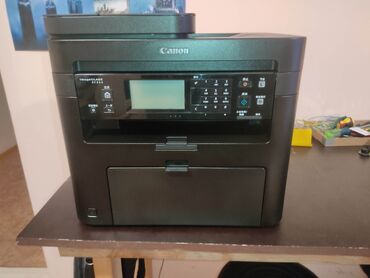 ми принтер: МФУ Canon MF215 — лазерное монохромное устройство «3‑в‑1»: печать