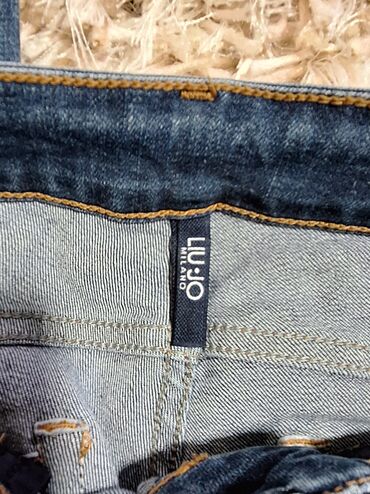 Farmerke: Ženske farmerice od tamno-plavog teksasa sa ravnim krojem i srednjim na lalafo.rs — 8 Farmerke: Ženske farmerice od tamno-plavog teksasa sa ravnim krojem i srednjim — 8