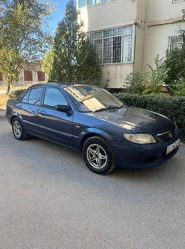 ua 705: Mazda Familia: 2002 г., Автомат, Бензин, Седан — 4