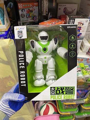 rey ben: Игрушечный робот Police Robot в коробке. Робот выполнен в — 1