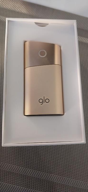 qızıl sirqa: Glo Series 2 – Gold rəngli tütün çubuğu qızdırma cihazı - Model: glo — 2