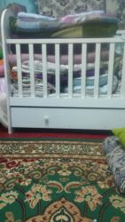 толокары детские: Детская кроватка с маятником и ящиком Описание: - Цвет: белый -