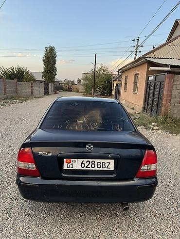 Унаа сатуу: Mazda 323: 1999 г., 1.6 л, Кол менен иштөөчү, Бензин, Седан — 4