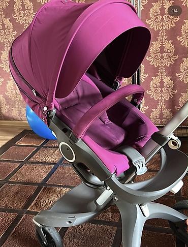 baş ortusu: Uşaq arabası – Stokke Xplory (bənövşəyi rəng) Xüsusiyyətlər: - Yüksək — 3