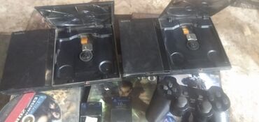 купить сони плейстейшен 3 в бишкеке: Две игровые приставки Sony PlayStation 2 черного цвета. В комплект