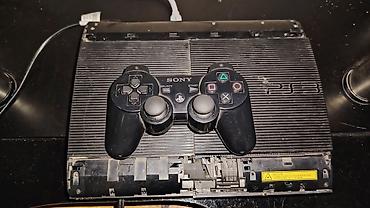 diz ustu notbuk: PlayStation 3 Super Slim oyun konsolu. Termo pasta deyişilib — 1