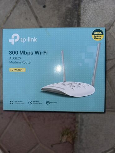 Kompüter ehtiyyat hissələri: TP-Link TD-W8961N ADSL2+ modem routeri. Bu cihaz, 300 Mbps Wi-Fi