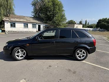 Транспорт: Mazda 323: 2002 г., 1.6 л, Механика, Бензин, Хэтчбэк — 6