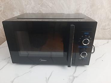 midea: Midea mikrodalğalı soba – kompakt və funksional masaüstü model — 2