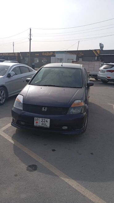 Honda: Продается Honda Stream, компактный минивэн синего цвета. Автомобиль