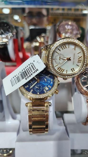 bakida saat: Michael Kors qadın qol saatı - Korpus: qızılı ton, bəzəkli daşlarla — 10
