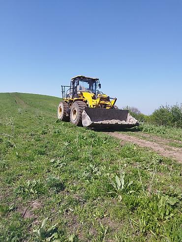 трактор лавол: Погрузчик, XCMG, 2010 г., Колесный, Ковшовый — 1
