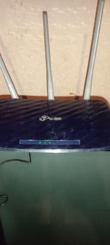 modem ustası: TP-Link Wi‑Fi marşrutizatoru (3 antenalı) - Model: Archer seriyasına — 3