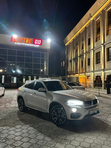 беха машина: BMW X6 (кузов F16), белый кроссовер-купе. Основные особенности