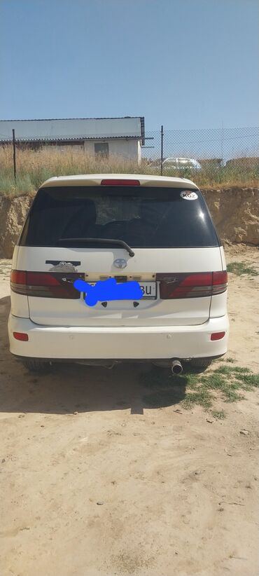 машина kg каракол: Белый минивэн Toyota Estima с задним спойлером. Автомобиль просторный