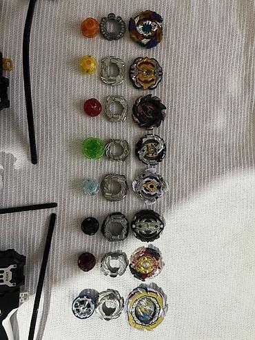 Игрушки: Набор Beyblade Burst с пусковыми устройствами и волчками. В комплект — 1
