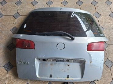 Бамперы: Передний Бампер Mazda 2003 г., Б/у, цвет - Серебристый, Оригинал