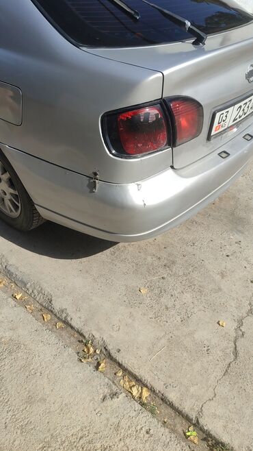 задние фары нексия 2: Автомобиль Nissan Primera, седан, серебристого цвета. Оснащен