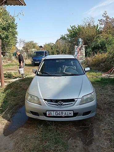 roewe rx5: Mazda 323: 2004 г., Механика, Бензин, Хэтчбэк — 6