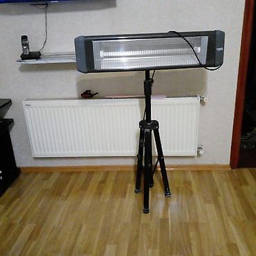 atena yag: Tripod üzərində infraqırmızı elektrik qızdırıcısı. Uzun gövdəli bu — 1