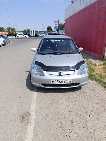 хонда сыйырбы: Автомобиль Honda Civic серебристого цвета с кузовом хэтчбек. Оснащен
