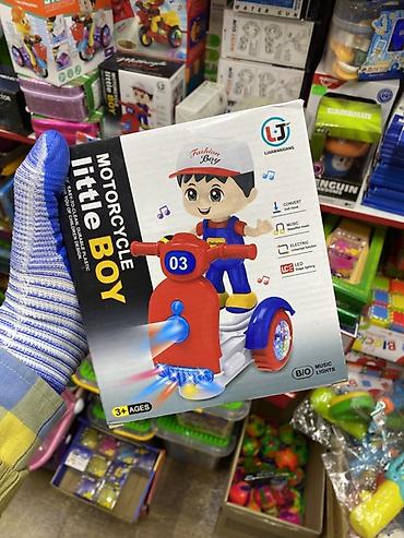 kinder joy: Детская музыкальная игрушка **Motorcycle Little Boy**. Яркая игрушка — 1