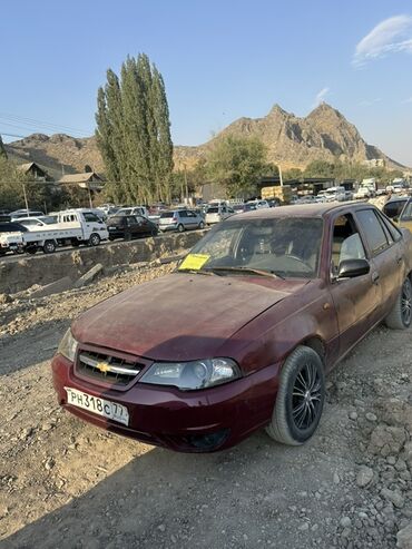 сполер нексия: Автомобиль Chevrolet Nexia бордового цвета, выпущенный в 2011 году