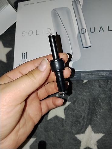 Şəxsi əşyalar: Lil SOLID DUAL (IQOS təqdimatı) – tütün isidən cihaz Qutu tərkibi: - — 8