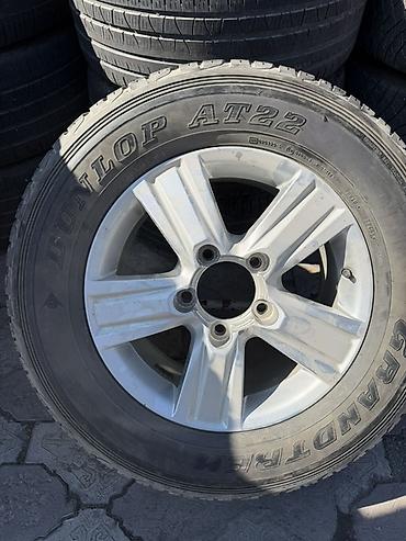 Шиналар жана дисктер: Легкосплавный диск с шиной Dunlop Grandtrek AT22. Параметры по фото — 1