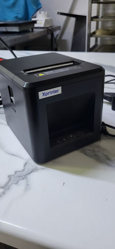 промышленные швейные машины: Черный термопринтер Xprinter XP-Q200 предназначен для печати чеков и