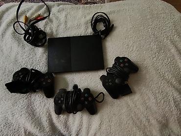 PlayStation 2 Slim komplekti - Konsol: Sony PlayStation 2 Slim (SCPH