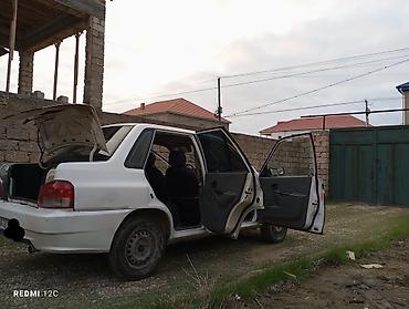 1 9 tdi: Ağ rəngli sedan, şəhərdaxili sürüş üçün praktik və qənaətcil — 10