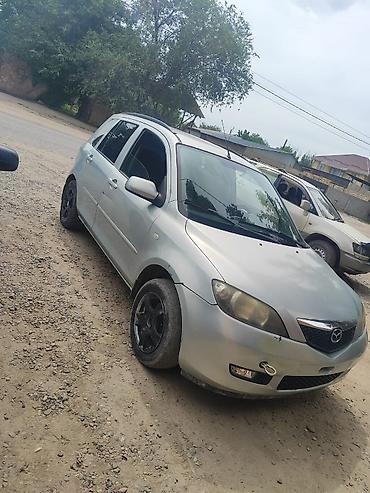 210 миллениум: Mazda Demio: 2005 г., 1.5 л, Робот, Бензин, Хэтчбэк — 2