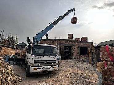 Аренда манипулятора: Услуги автокрана-манипулятора на базе Hyundai имеется бадья корыто — 9