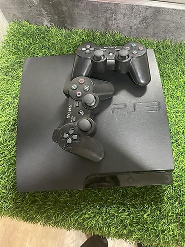 диски для игр: Sony PlayStation 3 (PS3) Slim с двумя беспроводными геймпадами — 1