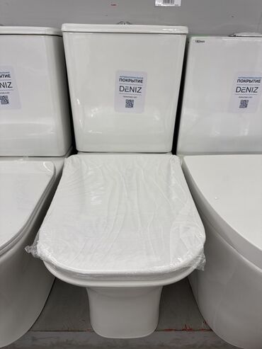 детское сиденье для унитаза: Белый унитаз с покрытием DENIZ. Изделие имеет классический дизайн