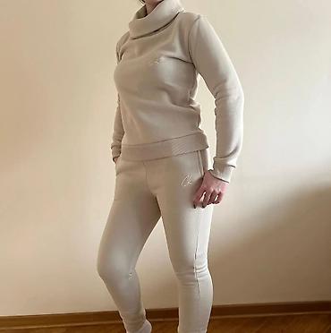 Gornji i donji deo: Ženski komplet trenerke – duks i donji deo - Model: duks sa visokim — 10